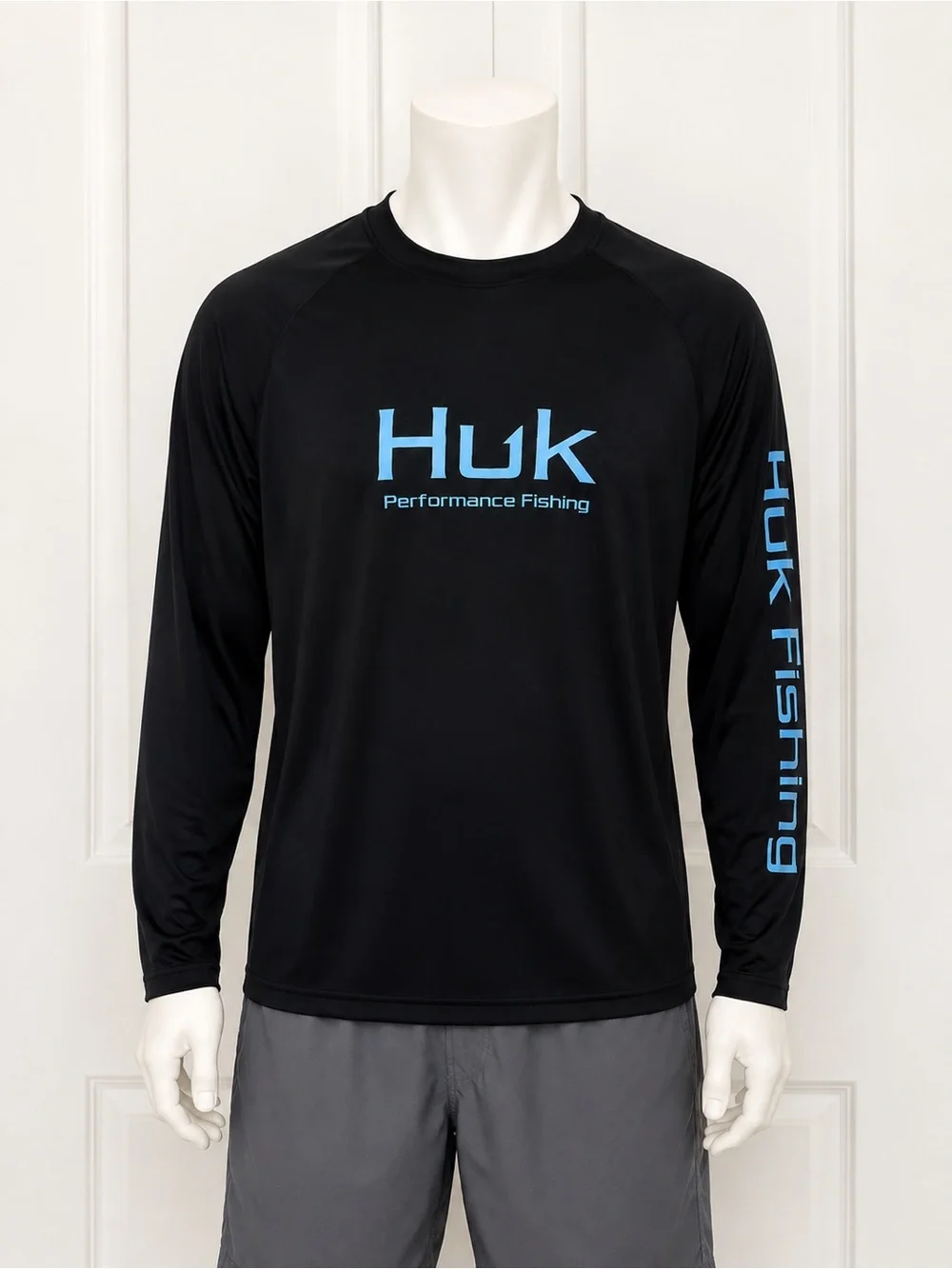 Huk Men's Black Long-Sleeve Performance Rash Guard with Blue Logo
